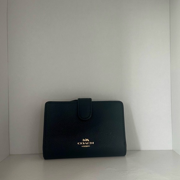 This coach wallet has been used before, but it is in decent shape. - Picture 6 of 6